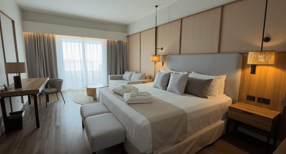 Deluxe Room, 1 King Bed, Balcony, Garden View | Free minibar, in-room safe, desk, laptop workspace