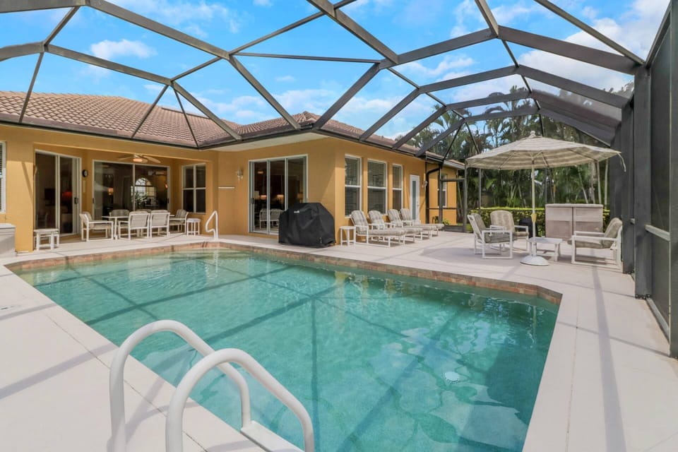 Enjoy the very best of the Florida living in this home, complete with a heated pool and expansive, fully screened, outdoor living space