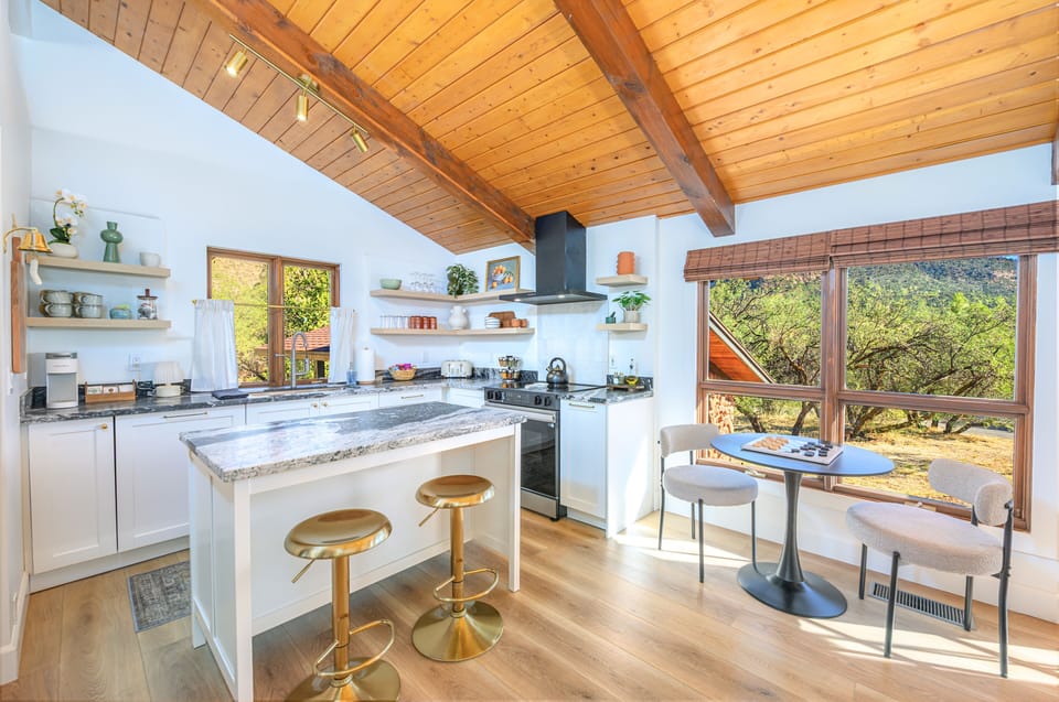 Fully equipped kitchen with cookware, spices, oil and a coffee and tea bar.