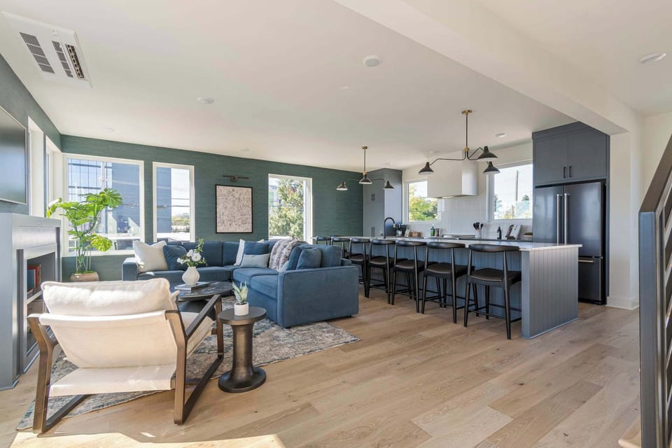 Seamless flow between the living room, dining area, and kitchen.
