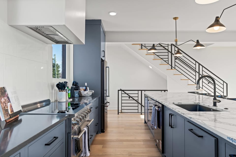 Fully equipped kitchen with premium appliances and generous counter space.