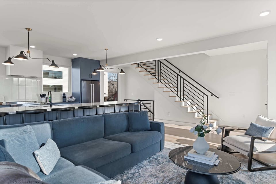 Open living area with clean architectural lines and stair access.