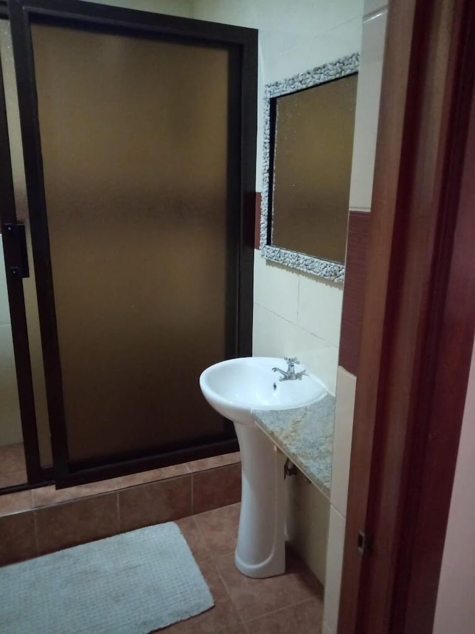 Standard Double Room | Bathroom | Shower, slippers, towels, soap