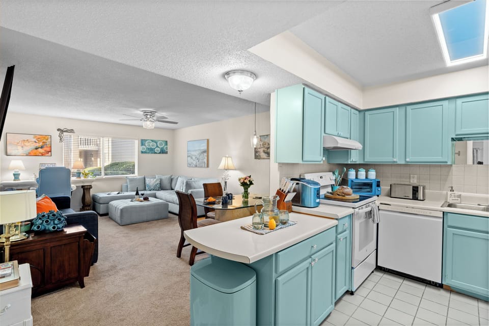 Fully-equipped kitchen area with ample counter space.