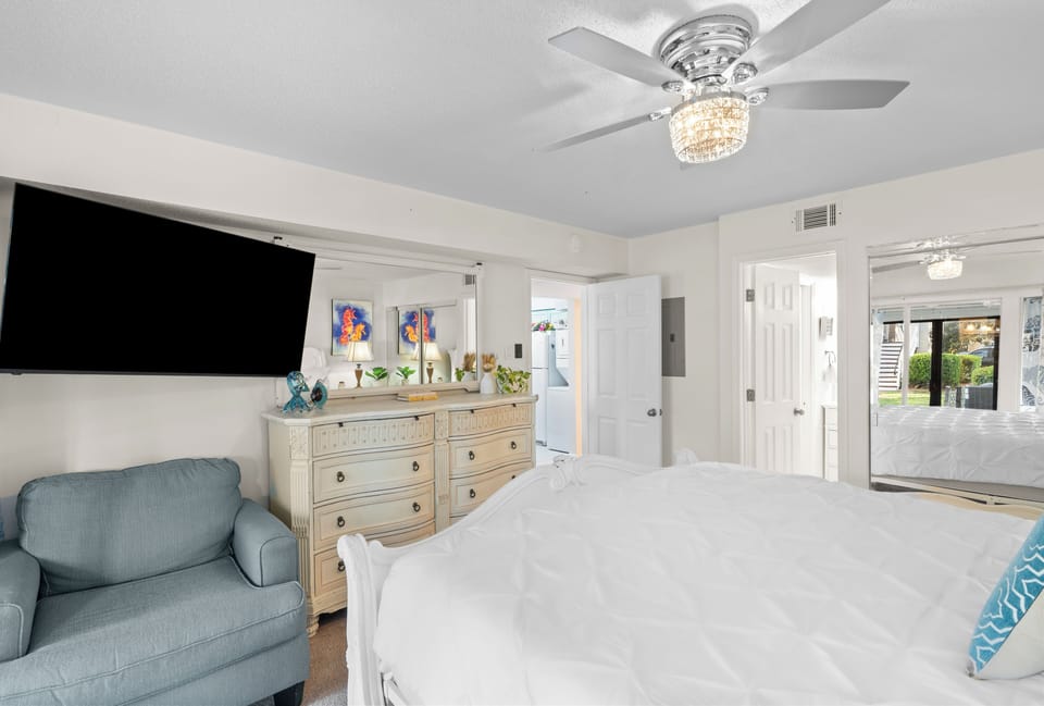 The bedroom features a king bed, TV, porch access and an ensuite bathroom.