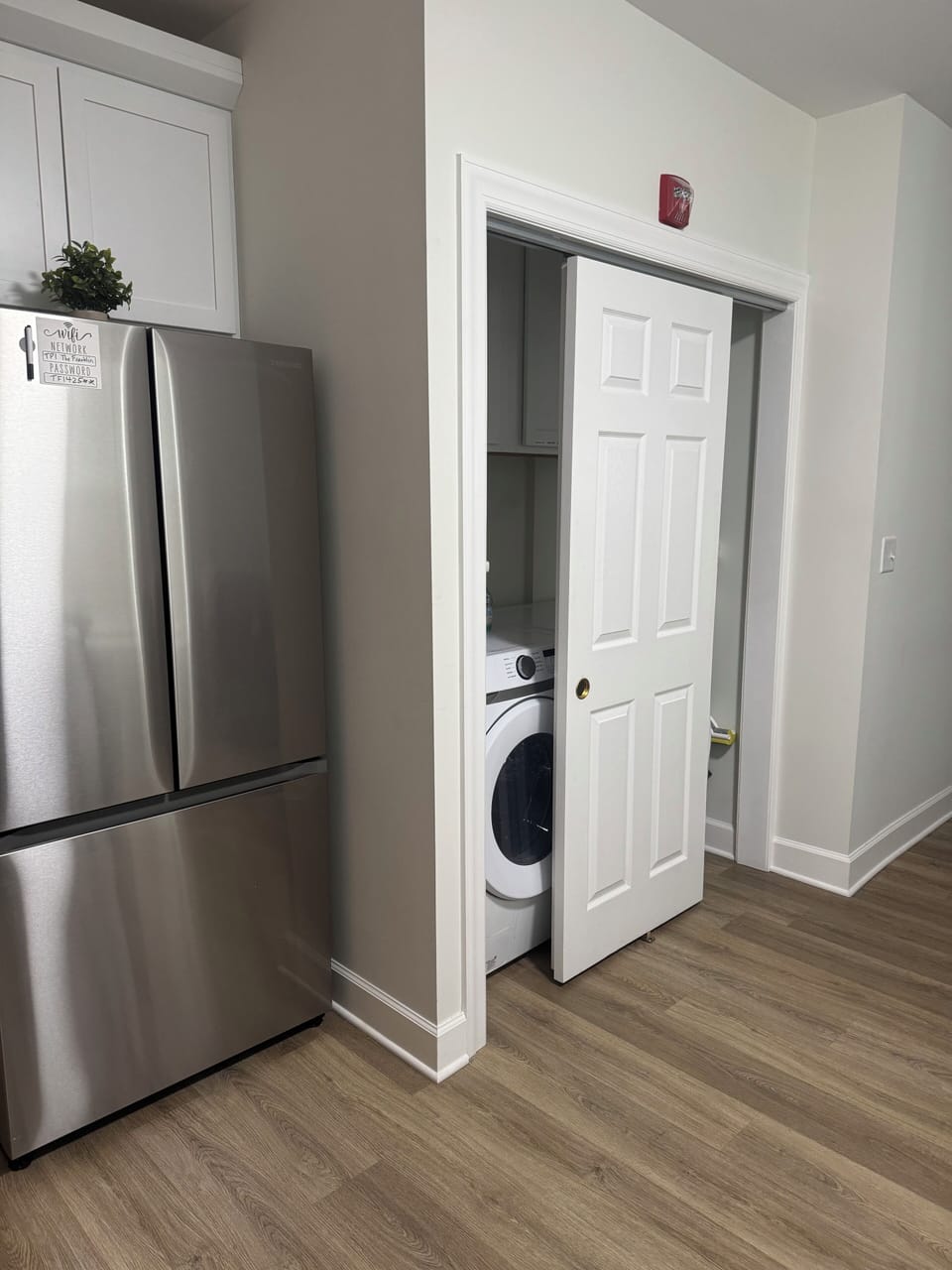 Full sized refrigerator/freezer, washer, dryer.