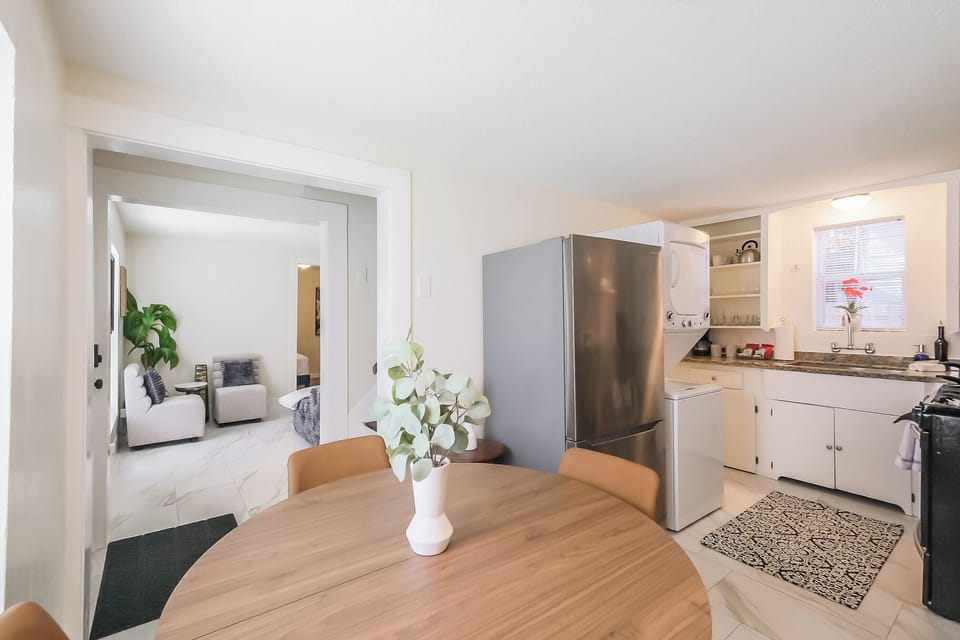 View of living room and kitchen from dining area