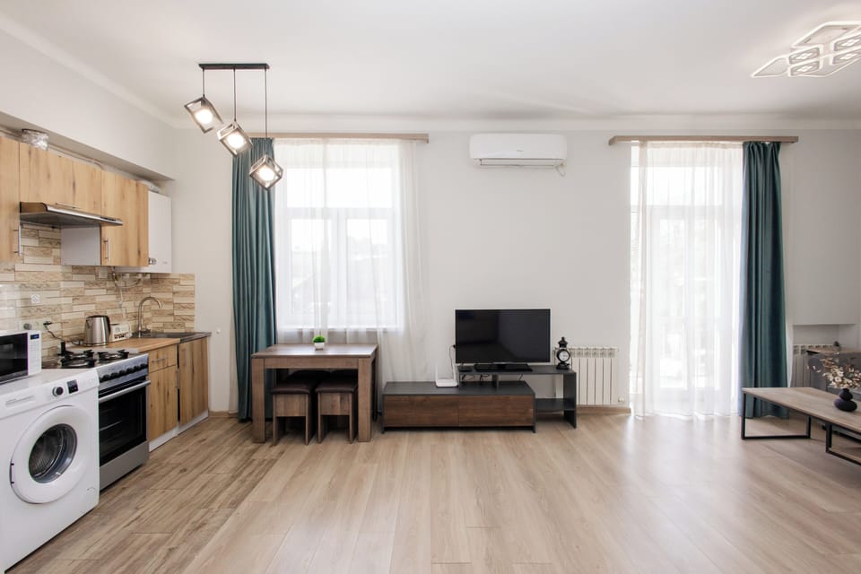 Basic Apartment, Balcony, Park View | Living area | 50-inch flat-screen TV with cable channels