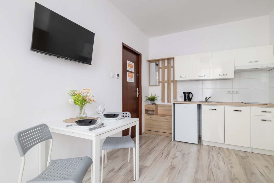 The elegant living area featuring a double sofa bed, perfect for relaxing or sleeping.