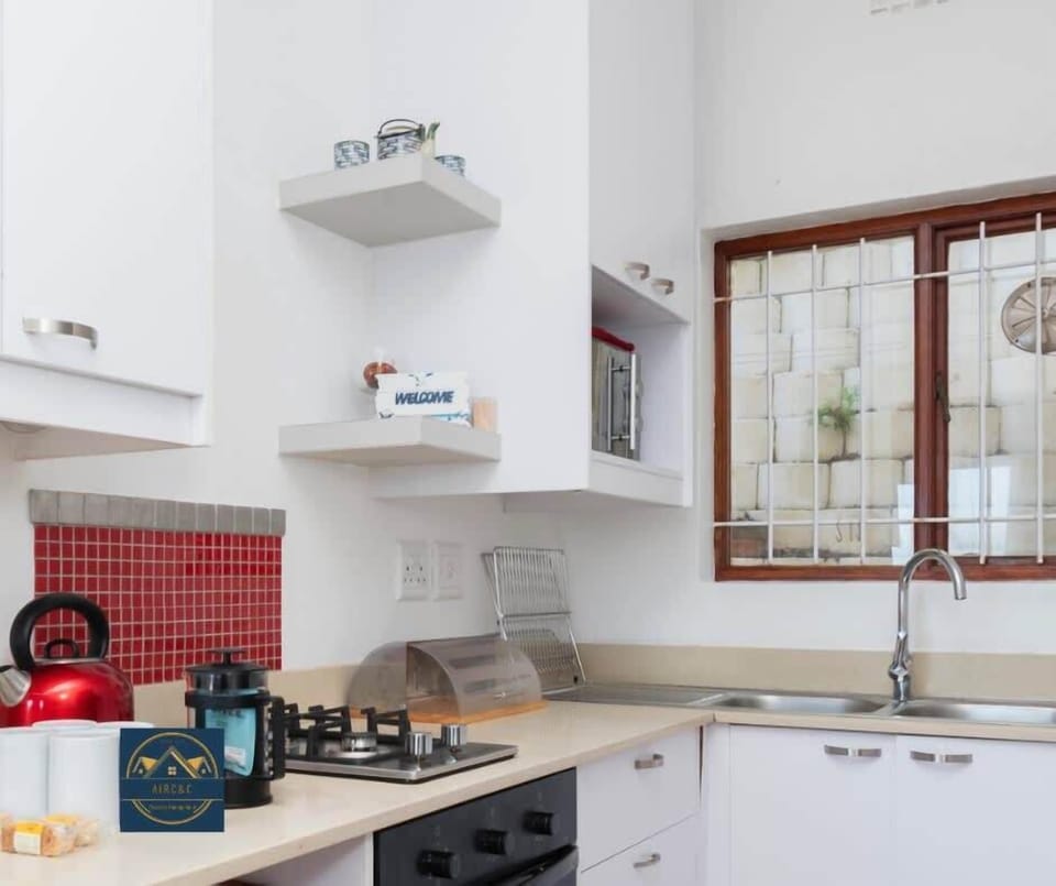 A well equipped kitchen for your use includes 2 plate gas stove and electric oven. 