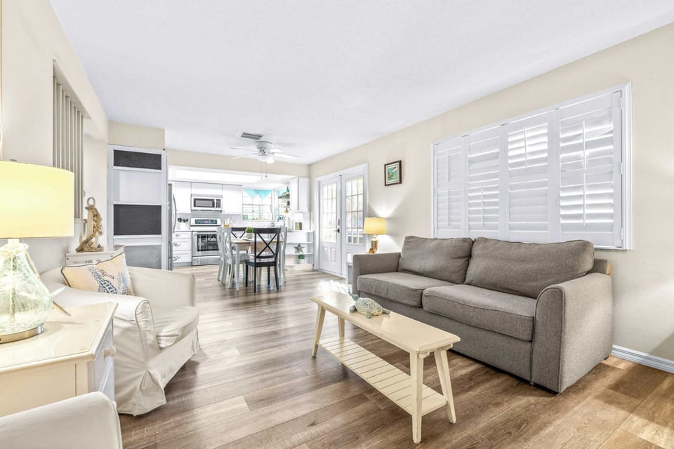 Bright living area with sofa sleeper and Smart TV