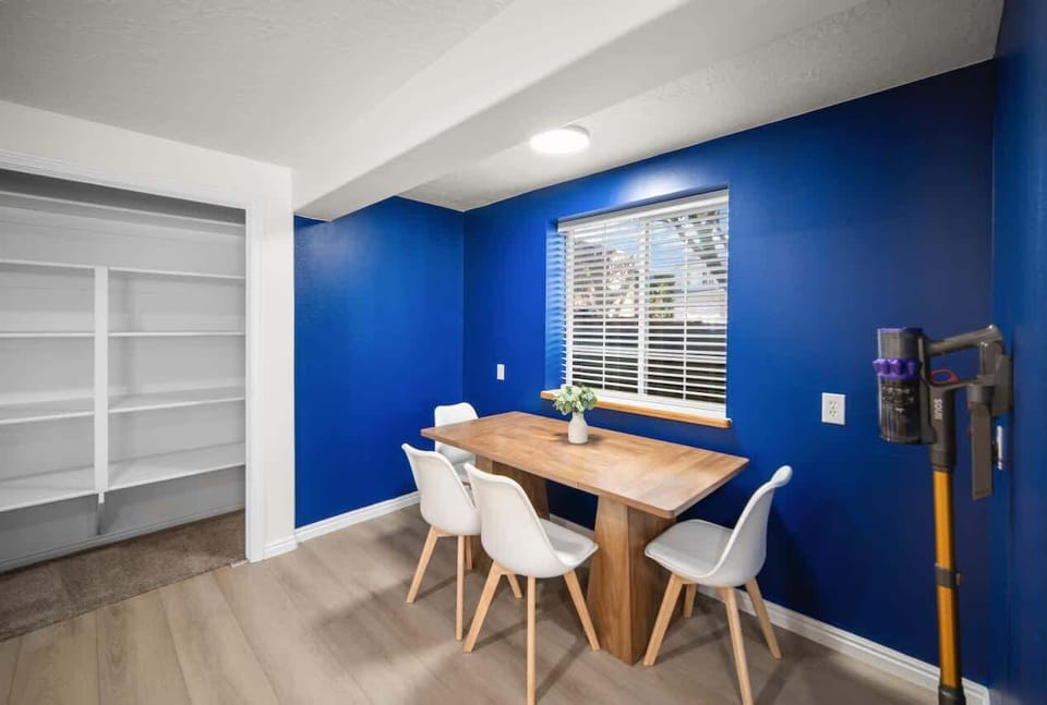 Downstairs second full-kitchen with seating and blending over into the game space area