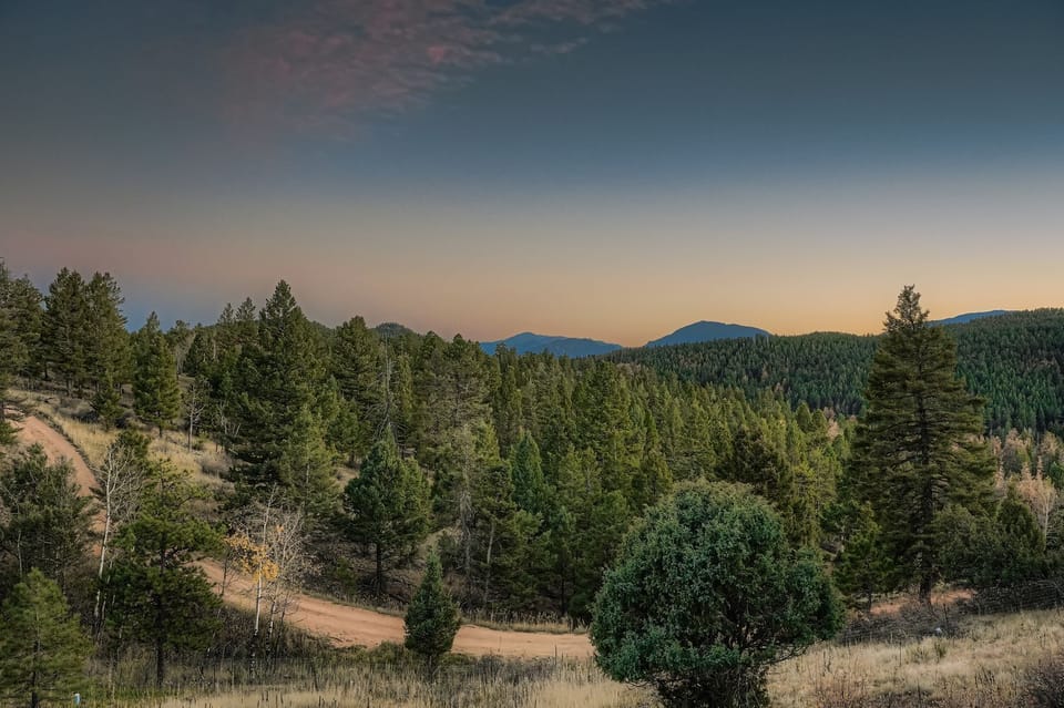 Scenic mountain view from the backyard at sunset.