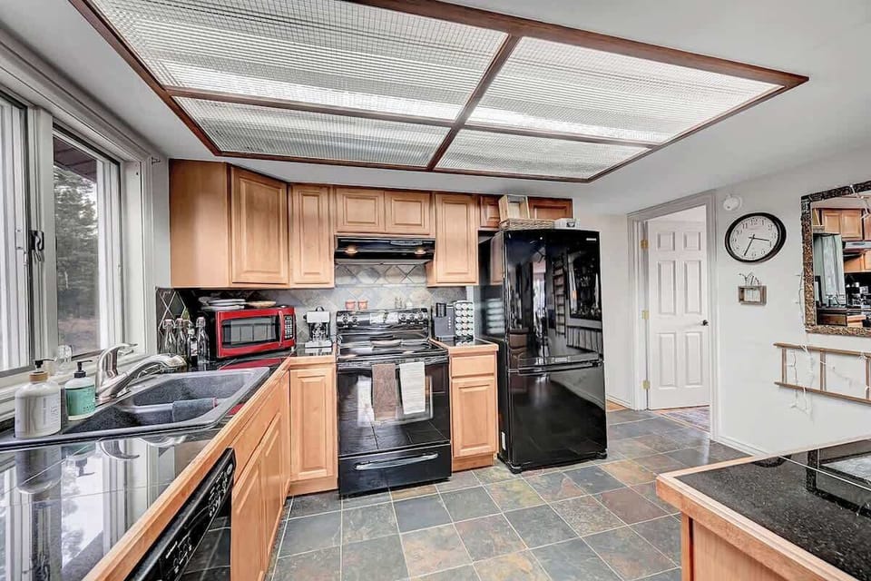 Bright and functional kitchen with mountain charm and plenty of counter space.