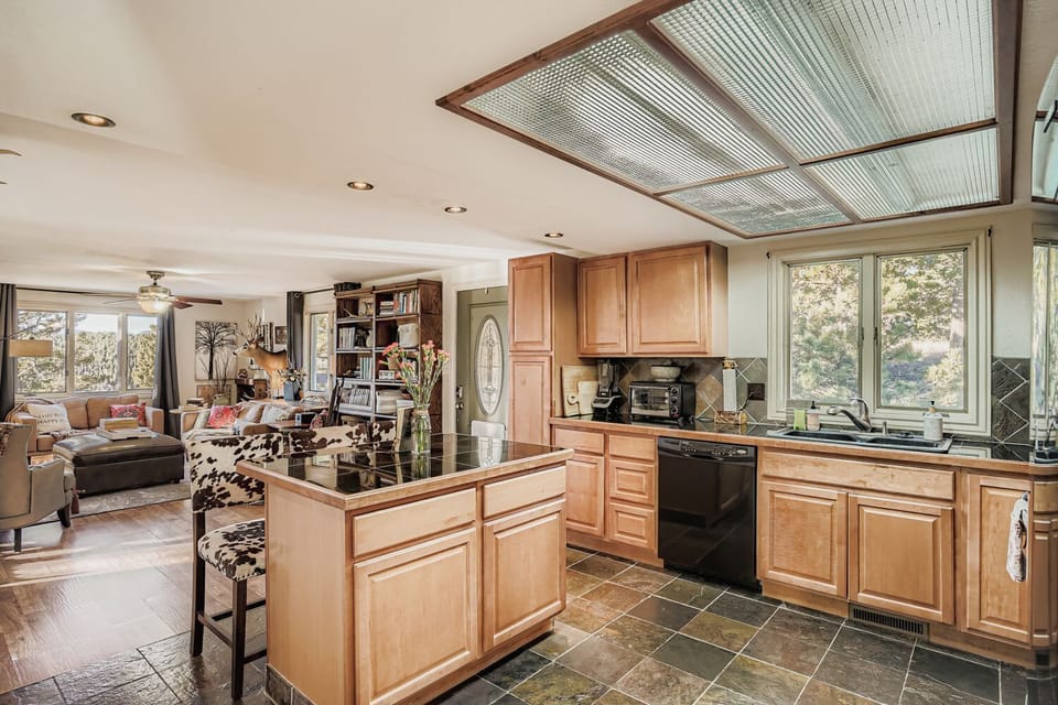 Bright kitchen featuring ample storage and a welcoming breakfast area.