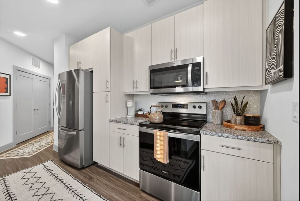 Modern Kitchen: Cook up a storm in this sleek kitchen with stainless appliances and chic decor!