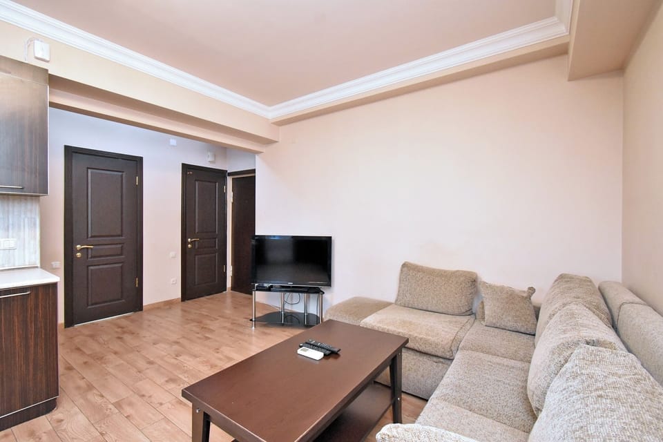Economy Apartment | Living area | 50-inch flat-screen TV with cable channels
