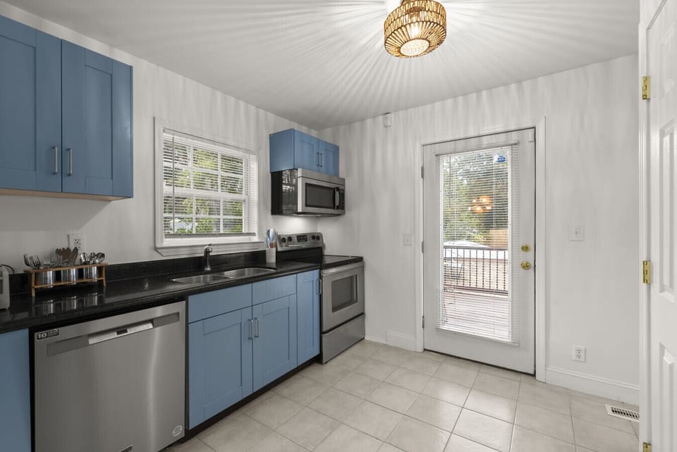 Galley style kitchen with stainless steel appliances