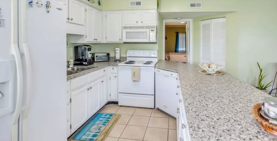 Cook meals in this bright, fully equipped kitchen with plenty of counter space.