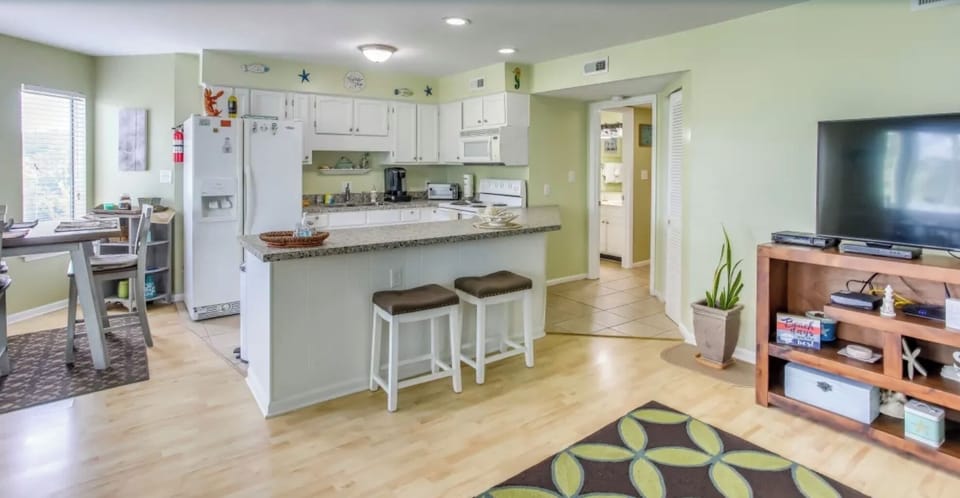 Enjoy your meals in this bright, sunlit dining area with a cozy atmosphere.