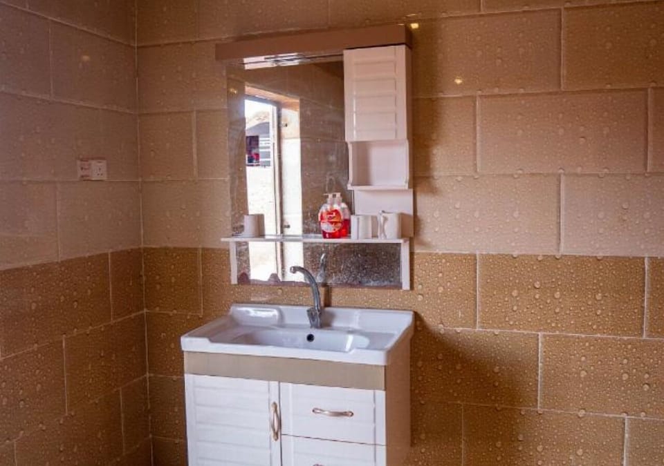 Bathrobes, slippers, bidet, towels