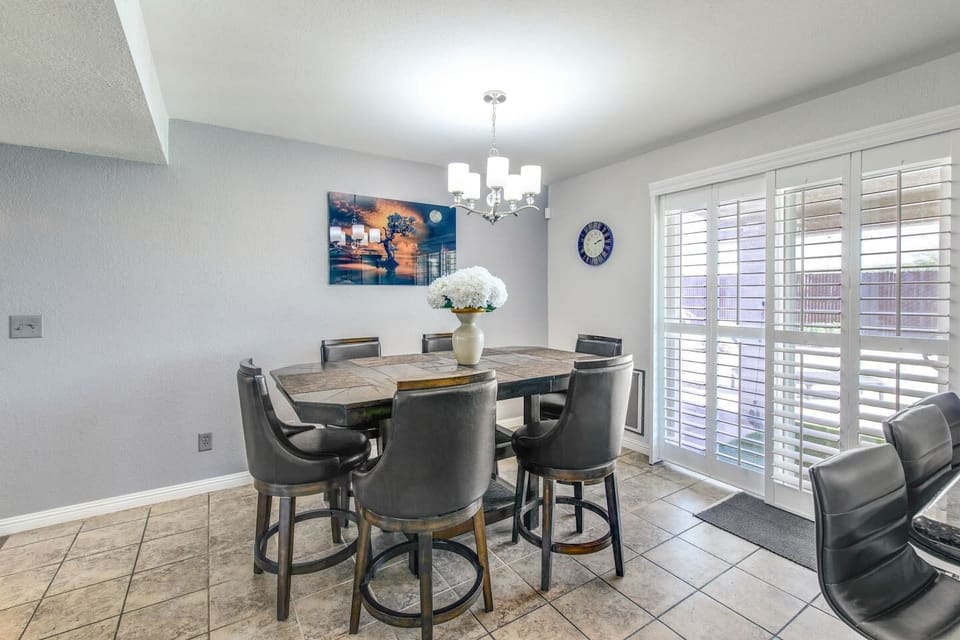 Relax and enjoy meals by the window in this inviting, sun-filled dining space.
