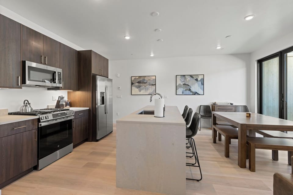Fully stocked gourmet kitchen with new appliances.