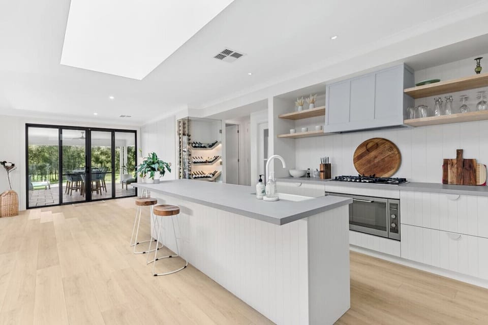 Our oversized kitchen space is at the heart of everything, from the fireplace lounge space, to the dining and sitting room that overlooks the pool - or slip through the glass door for the butlers pantry and laundry