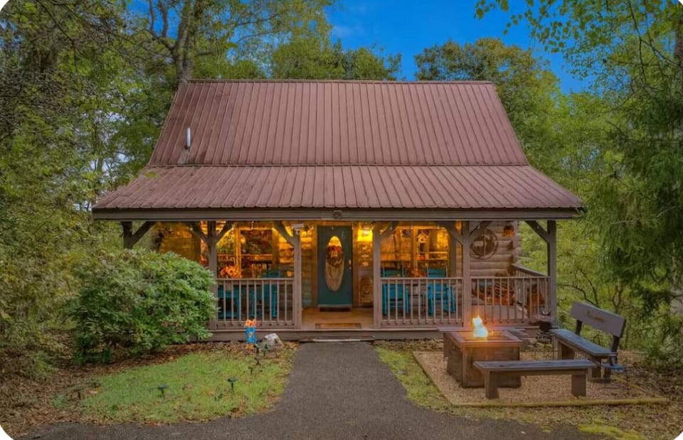Welcoming front entry with big front porch with 4 rocking chairs and a swing