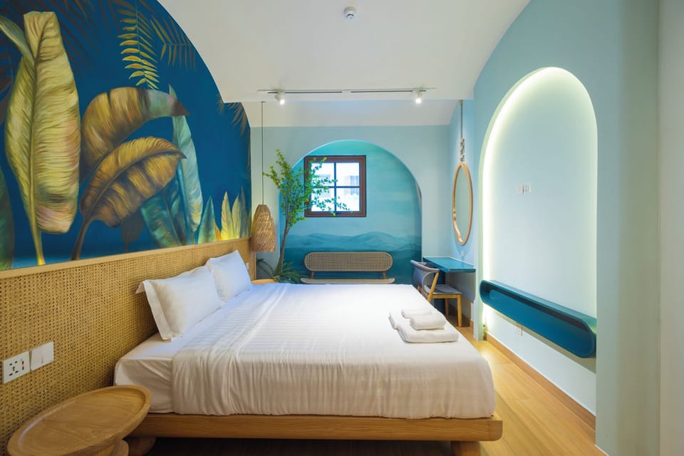 Design Studio Suite, Beach View | Free minibar items, in-room safe, desk, laptop workspace