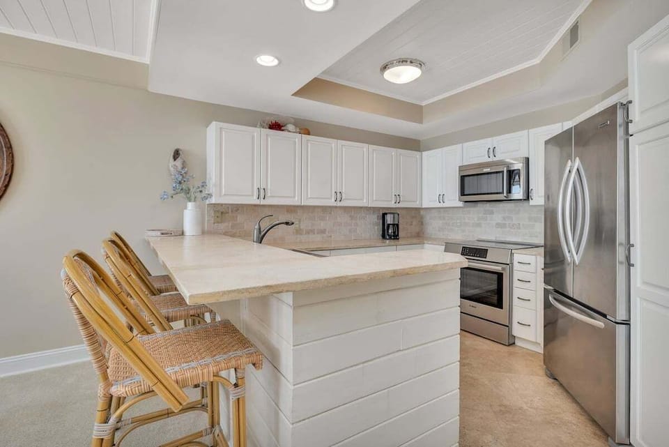 Saint Simons Grand #325 Kitchen with French Door Refrigerator, Electric Stove, and Over-the-Range Microwave