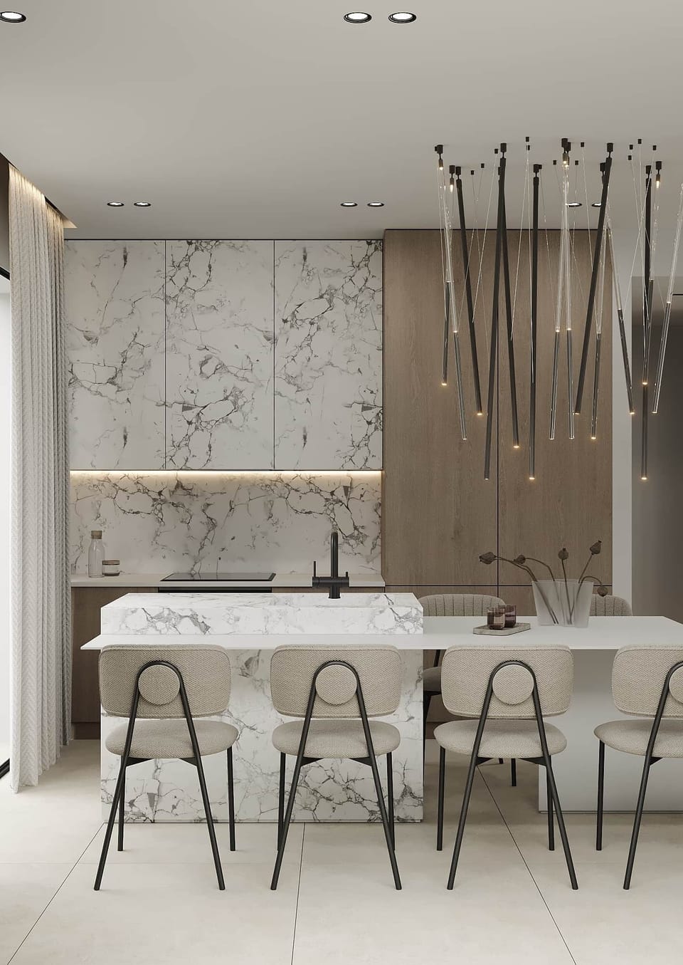Pendant lighting over marble island, minimalist design meets ambience.