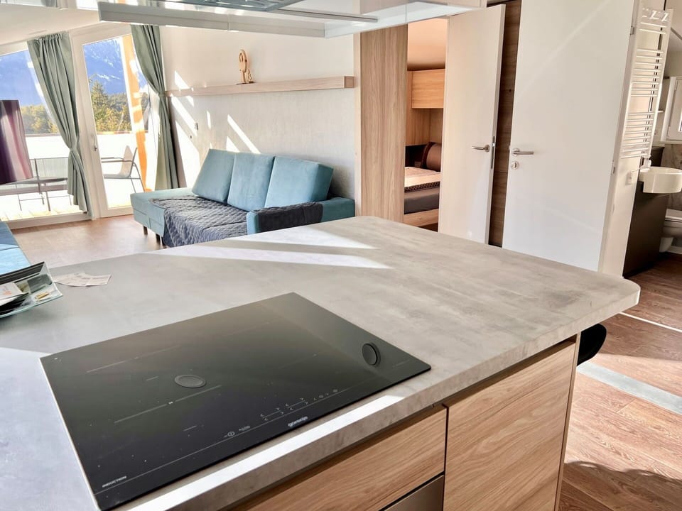 Countertop, Kitchen, Kitchen Stove, Hardwood, Wood Flooring, Gas Stove, Major Appliance, Wood Stain, Cabinetry, Kitchen Appliance