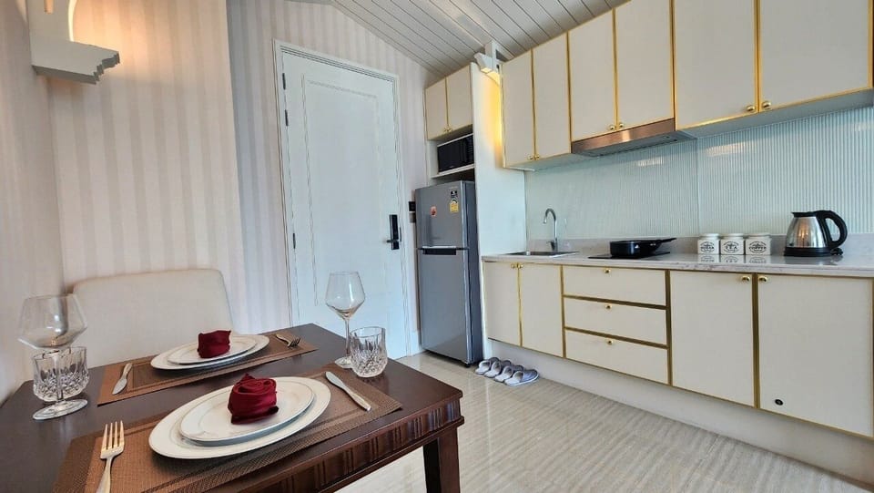 Condo, Balcony, Pool View | Private kitchenette | Full-size fridge, microwave, stovetop, electric kettle