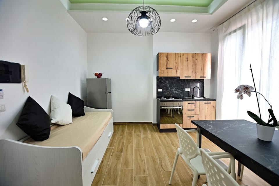 Family Room, Balcony, Partial Sea View | Blackout drapes, iron/ironing board, free WiFi