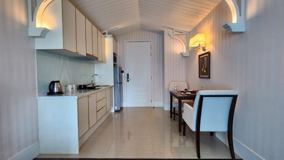 Condo, Balcony, Pool View | Private kitchenette | Full-size fridge, microwave, stovetop, electric kettle