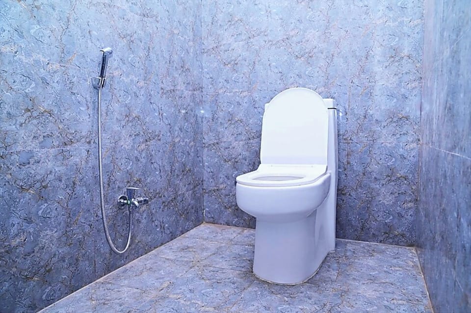 Shower, rainfall showerhead, slippers, towels