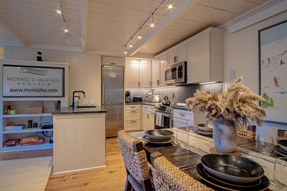 View of kitchen, dining, and Smart TV with cable