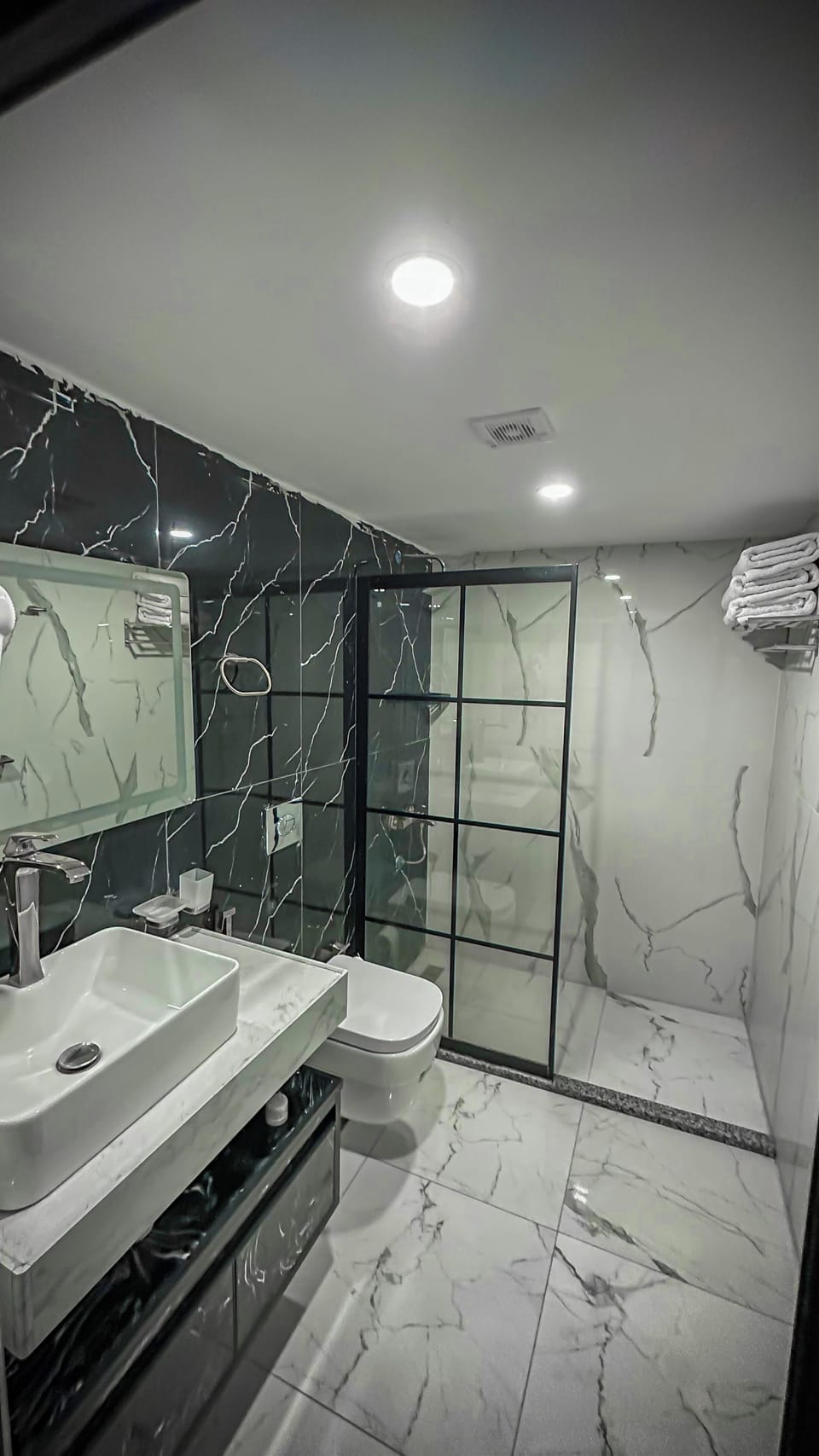 Separate tub and shower, towels, soap, shampoo