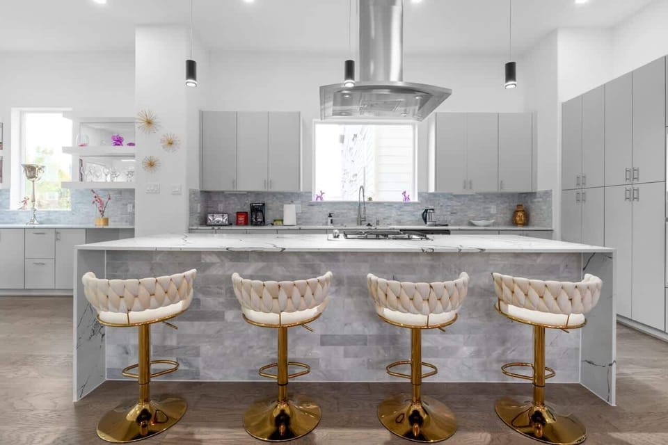 Sleek kitchen w/ clean counters, modern finishes, and everything laid out for easy cooking.