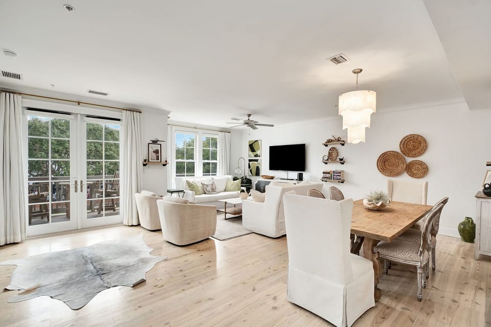 Living Room With Balcony Access Overlooking Park Lawn