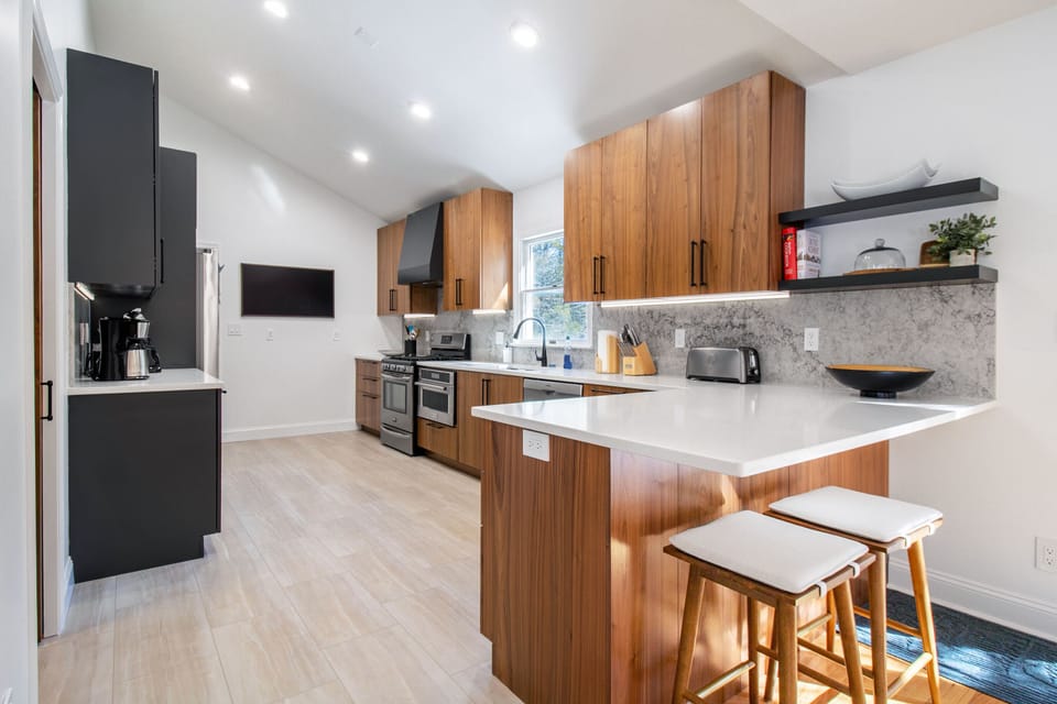 Full kitchen includes stove top, oven, built-in microwave, dishwasher, coffee station, TV, and more!
