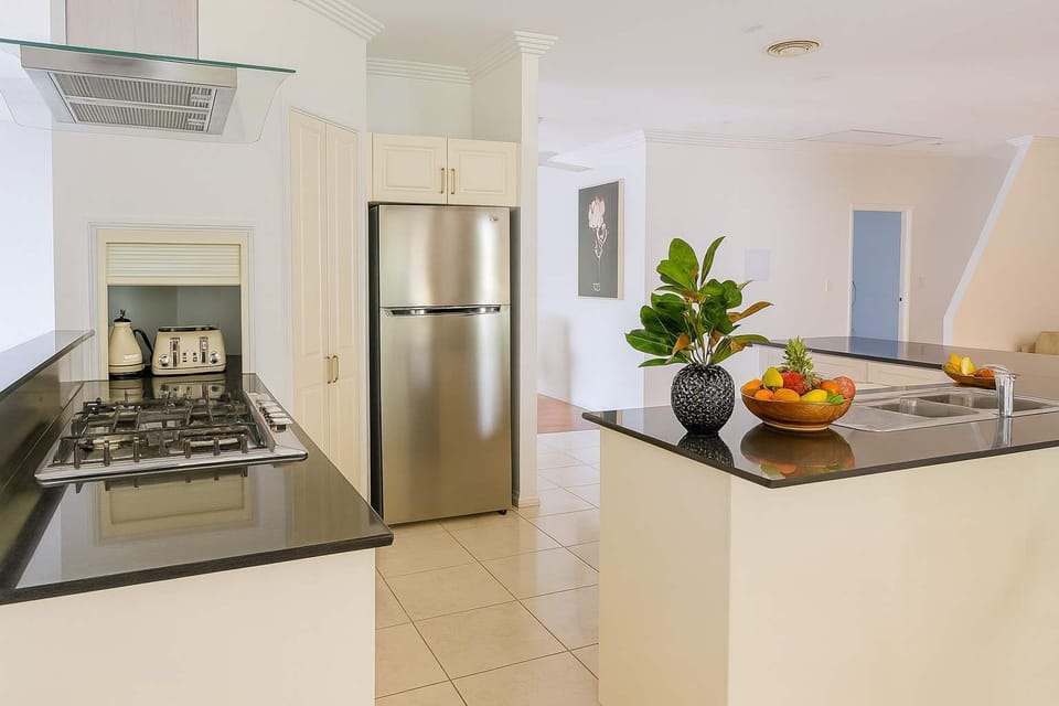 Cook up a storm in this entertainer’s dream kitchen!
With sleek stone benchtops, modern appliances, and plenty of space to move, this fully equipped kitchen is perfect for creating family feasts or hosting unforgettable gatherings.