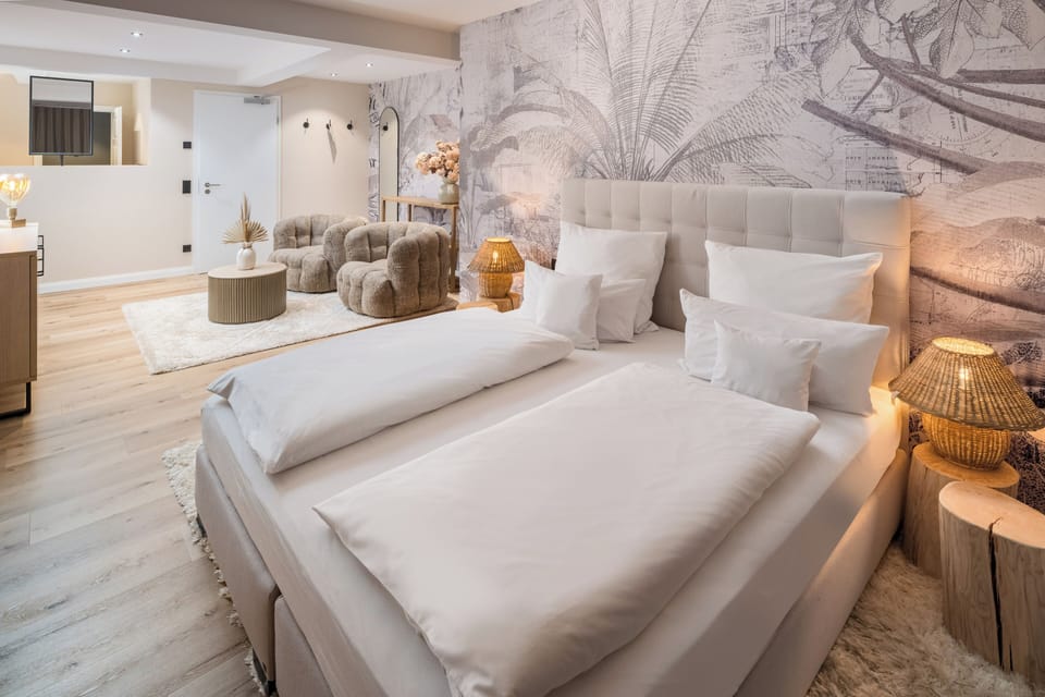 Junior Suite, Garden View | Premium bedding, minibar, in-room safe, individually decorated