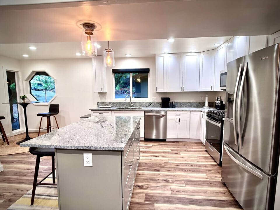 The kitchen island is a great place to sit and chat, have coffee or use to prepare meals.