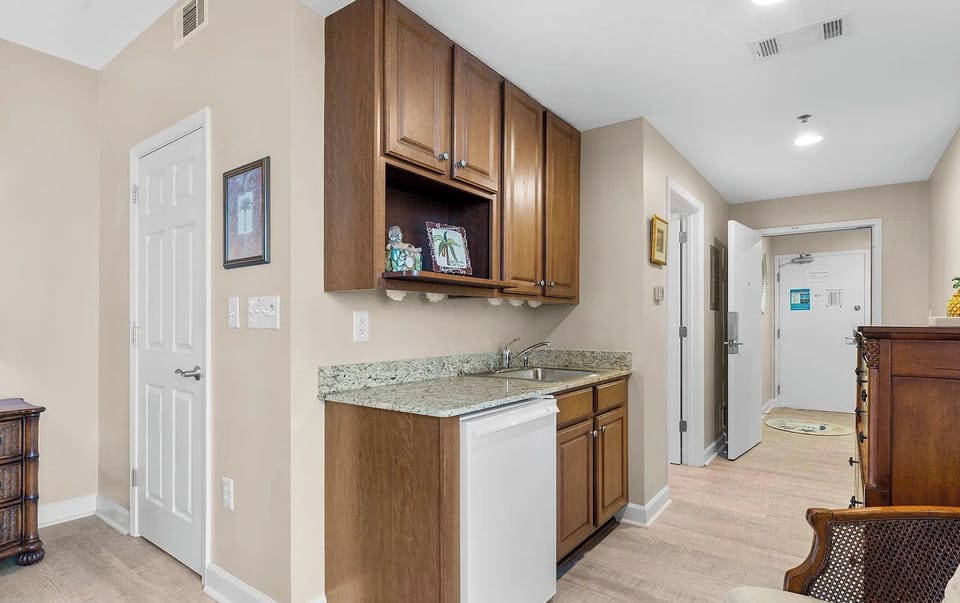 Master Suite with its own private balcony, bathroom, fridge, and coffee maker!