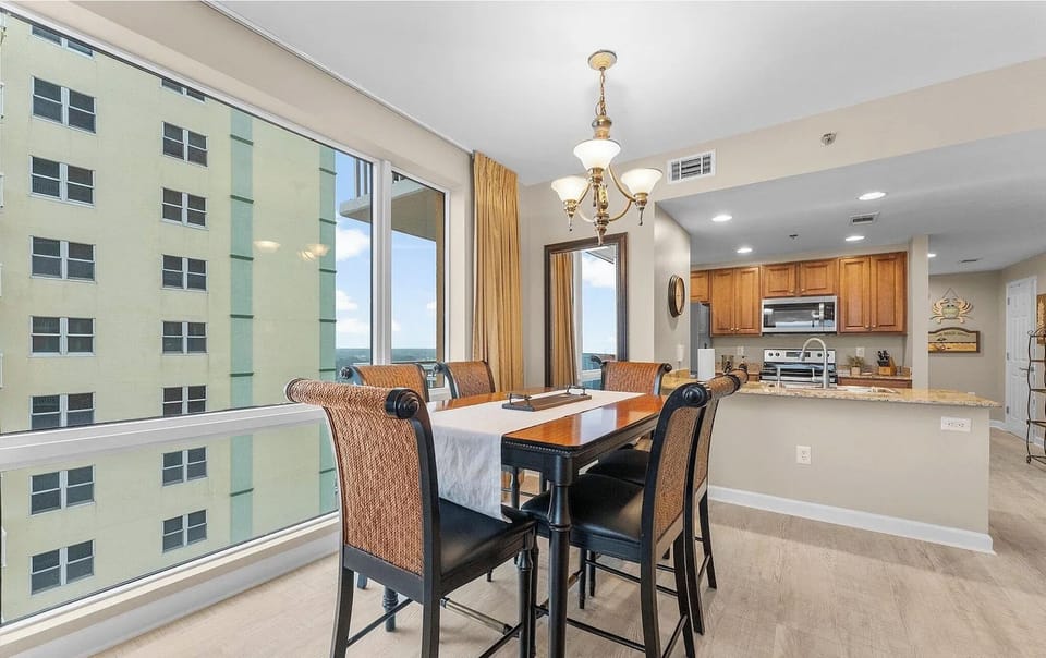 Dining area with 6 chairs around the table! 