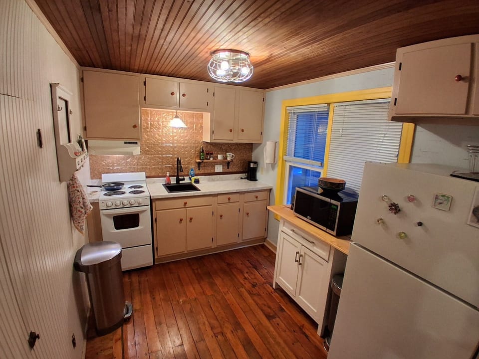 Kitchen (fully stocked with what you need to cook and serve a meal)