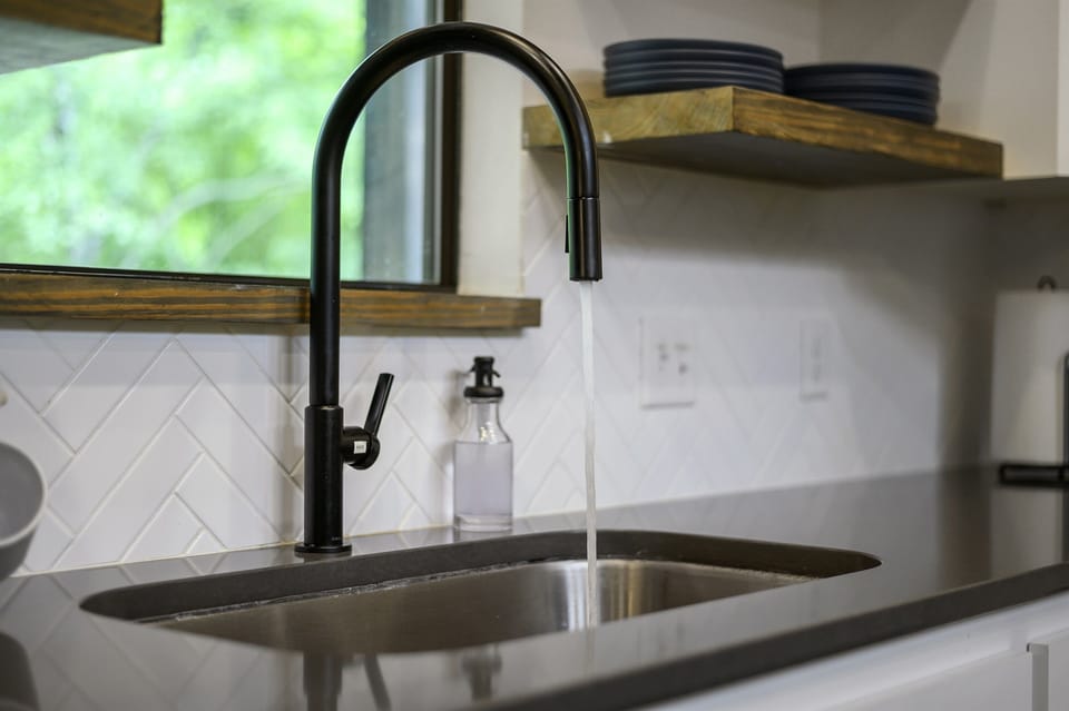 Modern kitchen sink with elegant finishes—great for home-cooked meals in a fully stocked space.