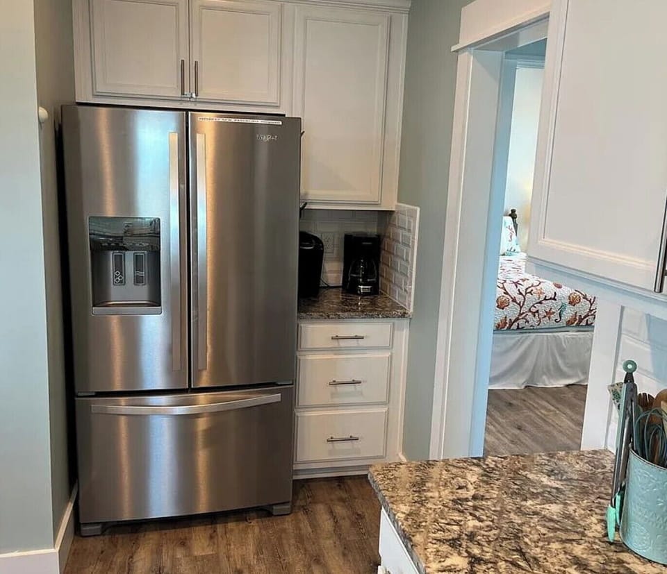 The kitchen has both a full-size coffee pot and a kierug. 